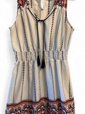 Y2K look boho dress with tassels and keyhole back detail.